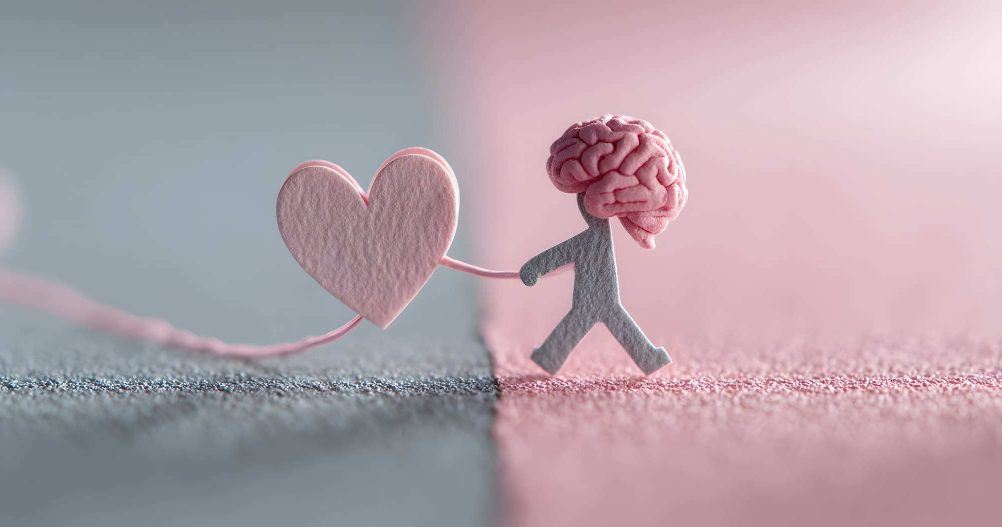 Illustration d’un personnage avec un cerveau tirant un cœur, symbolisant le lien entre les émotions et la santé mentale.